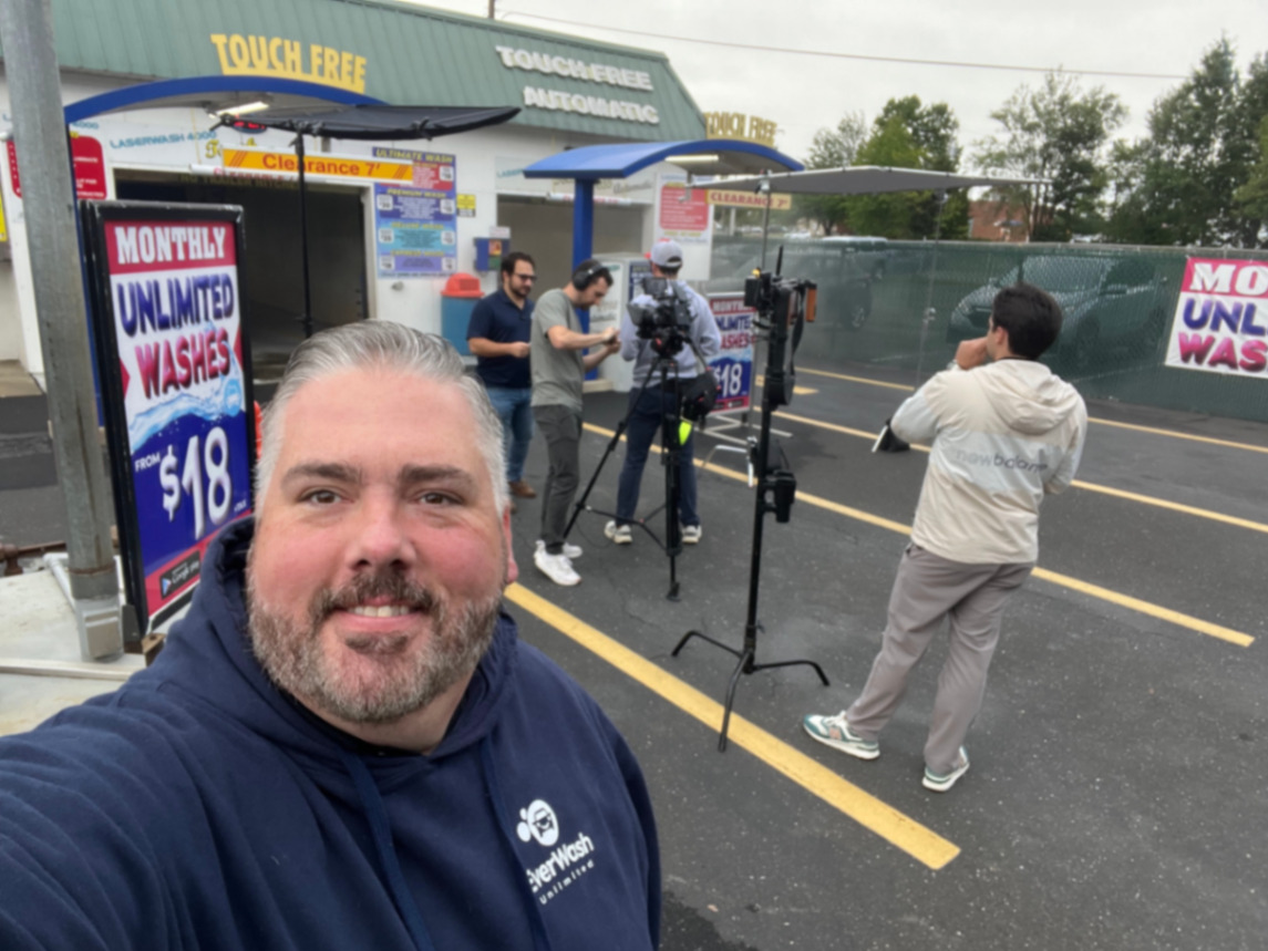 Sean on location filming at a car wash
